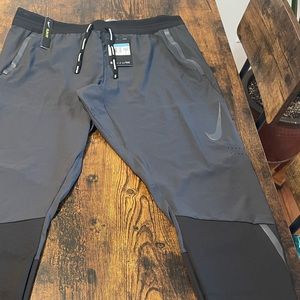 Nike Flex Running Pants.  Mens size medium. New with tags